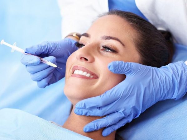 Picture of adult woman having a visit at the dentist's